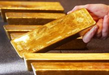Gold prices down amid positive risk sentiment