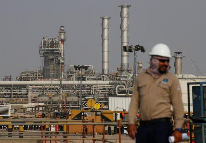 An employee looks on at Saudi Aramco oil facility in Abqaiq, Saudi Arabia
