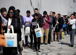 The number of Americans filing for unemployment benefits dropped to a nine-month low last week.