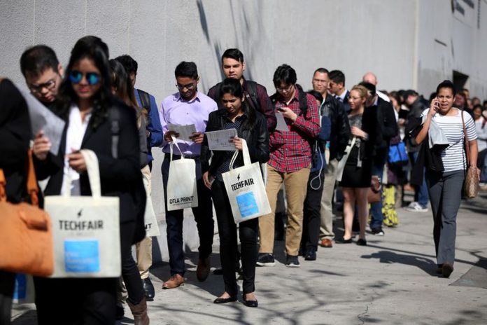 The number of Americans filing for unemployment benefits dropped to a nine-month low last week.