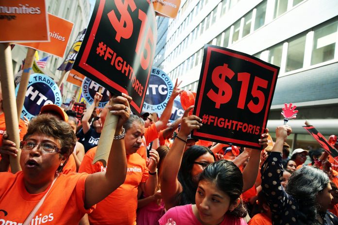 A rally for a $15 minimum hourly wage in New York City in 2015. The city raised its minimum wage to $15 in 2018, while New York State raised its minimum wage to $11.80 in December 2019, and that will increase statewide at the end of 2020 to $12.50