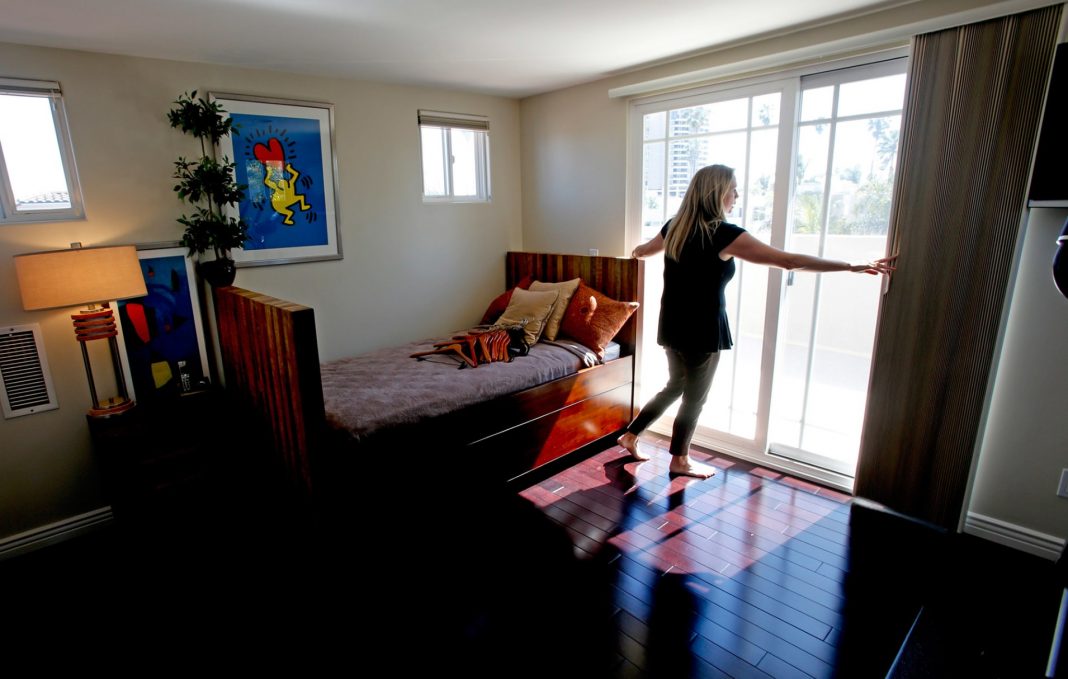 A real estate agent readies a house for viewing in Venice, Calif.