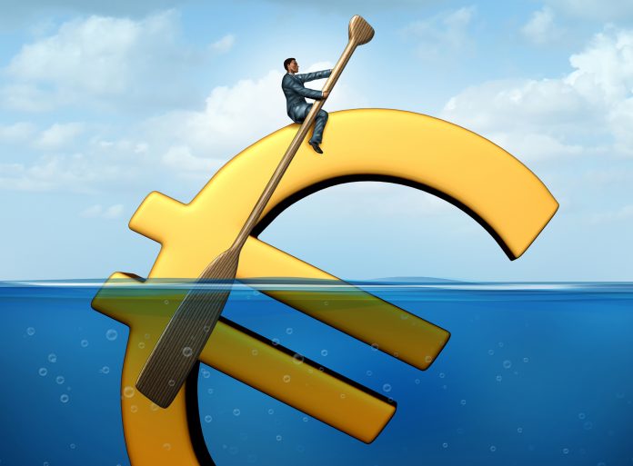Euro currency guidance financial concept as a european money icon floating in the water with a businessman using an oar to steer and guide the economic symbol.