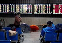 Asian shares were under water on Friday as fears over the creeping spread of the coronavirus sent funds fleeing to the sheltered shores of U.S. assets, lifting the dollar to three-year highs