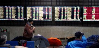 Asian shares were under water on Friday as fears over the creeping spread of the coronavirus sent funds fleeing to the sheltered shores of U.S. assets, lifting the dollar to three-year highs