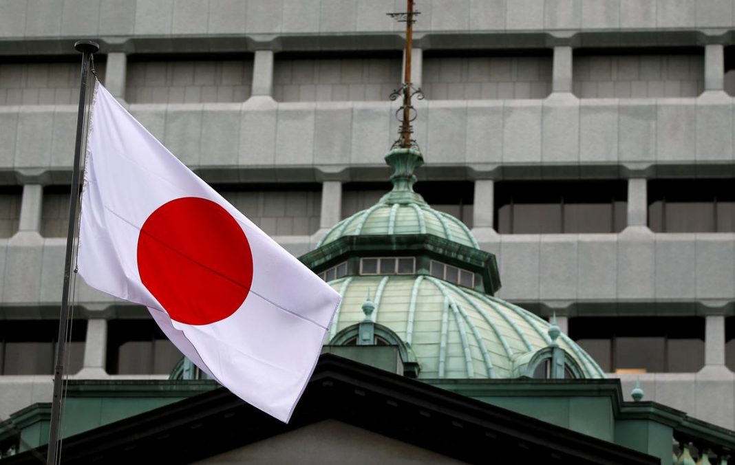 A Japanese flag flutters atop the Bank of Japan building in Tokyo, Japan, September 21, 2016.