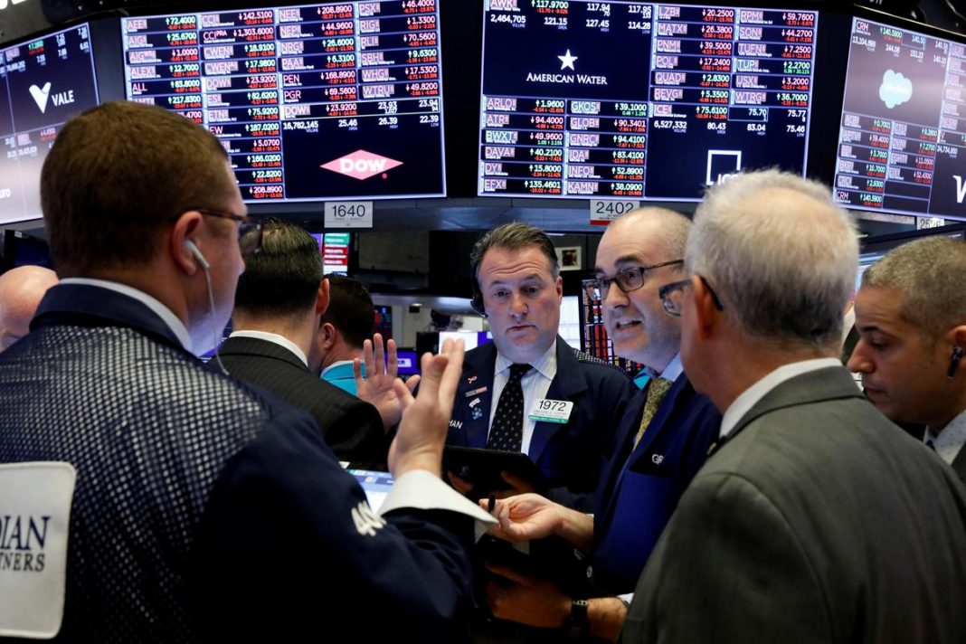 Traders work on the floor of the New York Stock Exchange (NYSE) near the close of trading in New York, U.S.