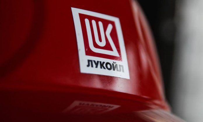 Lukoil company logo is pictured on a helmet at the Filanovskogo platform in Caspian Sea, Russia