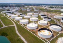 Crude oil storage tanks are seen in an aerial photograph at the Cushing oil hub in Cushing, Oklahoma, U.S.