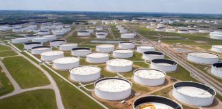 Crude oil storage tanks are seen in an aerial photograph at the Cushing oil hub in Cushing, Oklahoma, U.S.