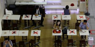 A food outlet in Singapore placed markers on selected tables to separate diners as authorities implement stricter social-distancing measures to combat the coronavirus outbreak.