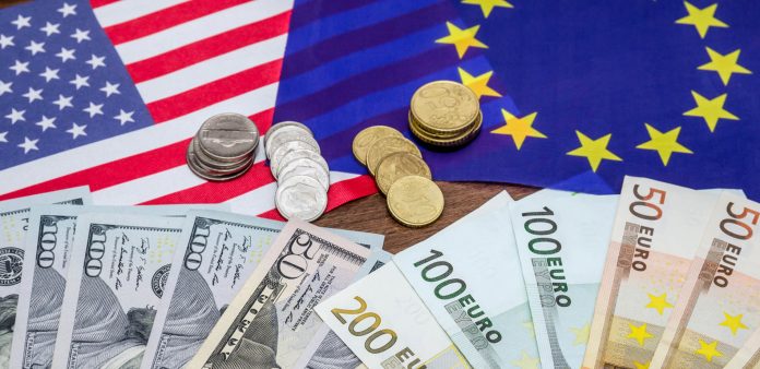 Dollars and euro with flag in table