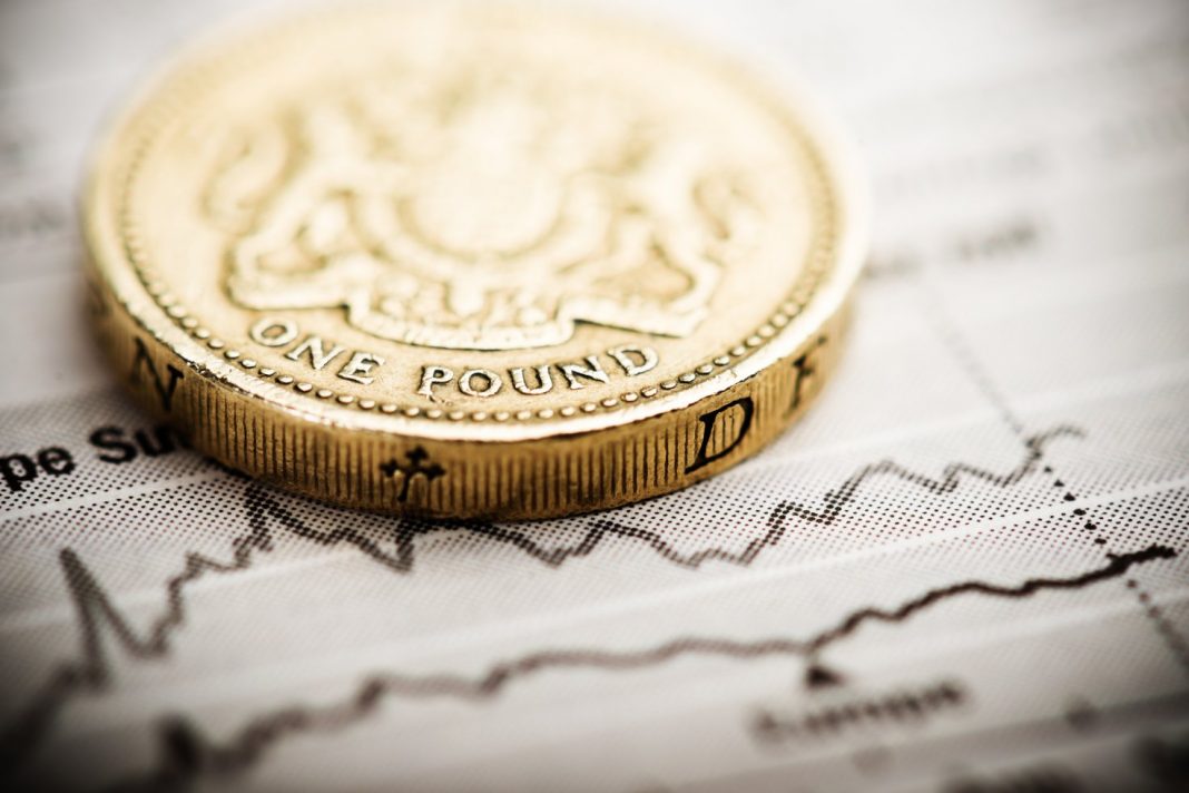 Sterling edged lower on Thursday against both the U.S. dollar and the euro as a combination of business activity data and the risk of sub-zero interest rates weighed on the pound.