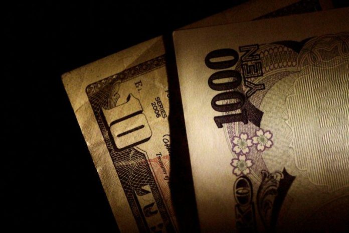 Japan Yen and U.S. Dollar notes are seen